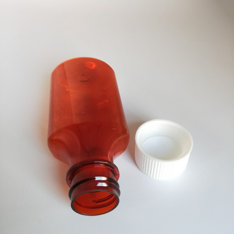 Botella ovalada líquida para mascotas de 60 ml de 2 oz con tapa a prueba de niños